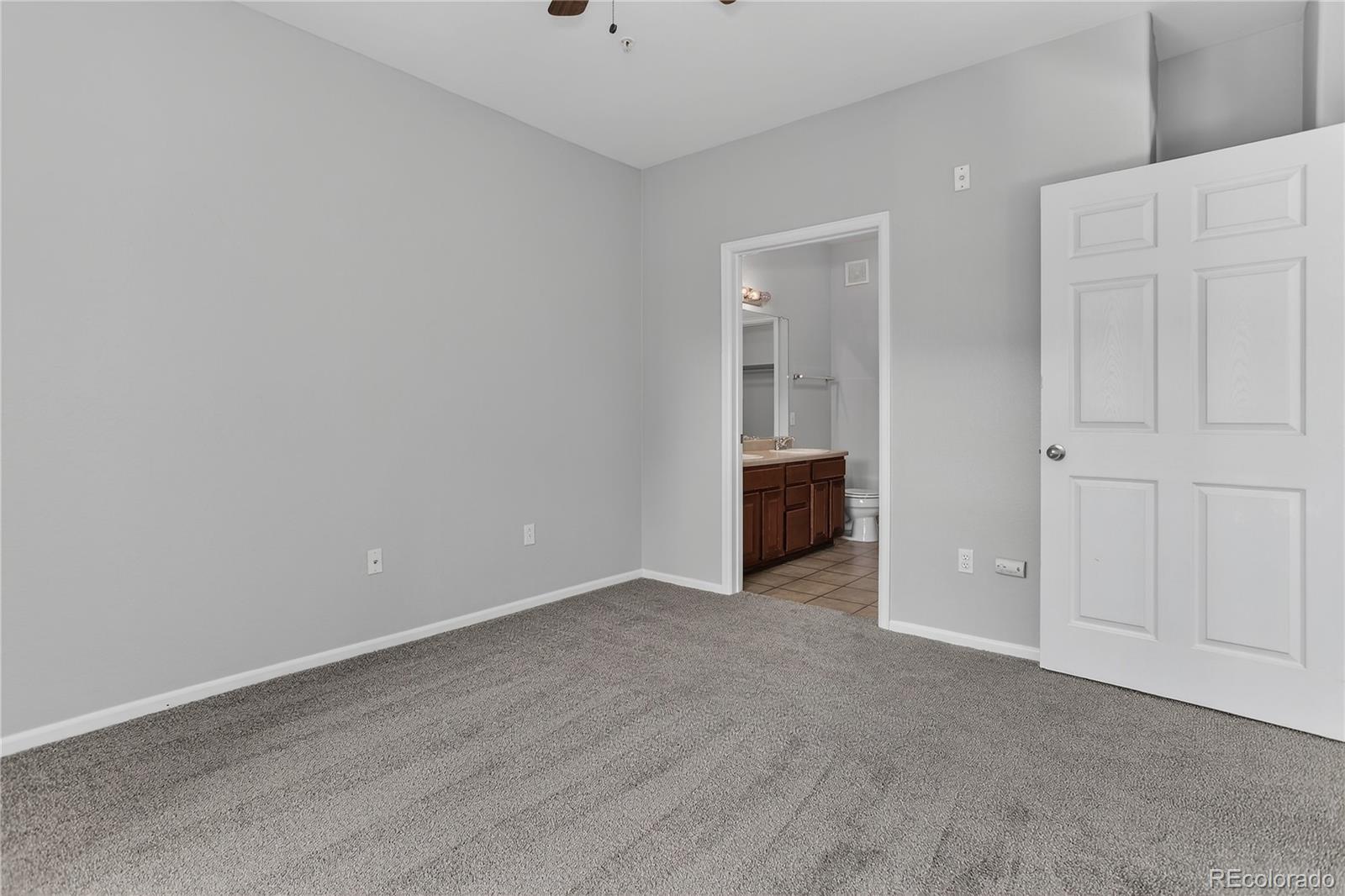 9633 East 5th Avenue, Unit 10208 Denver, CO 80230 - Photo 22 of 47 a view of an empty room with closet and entryway