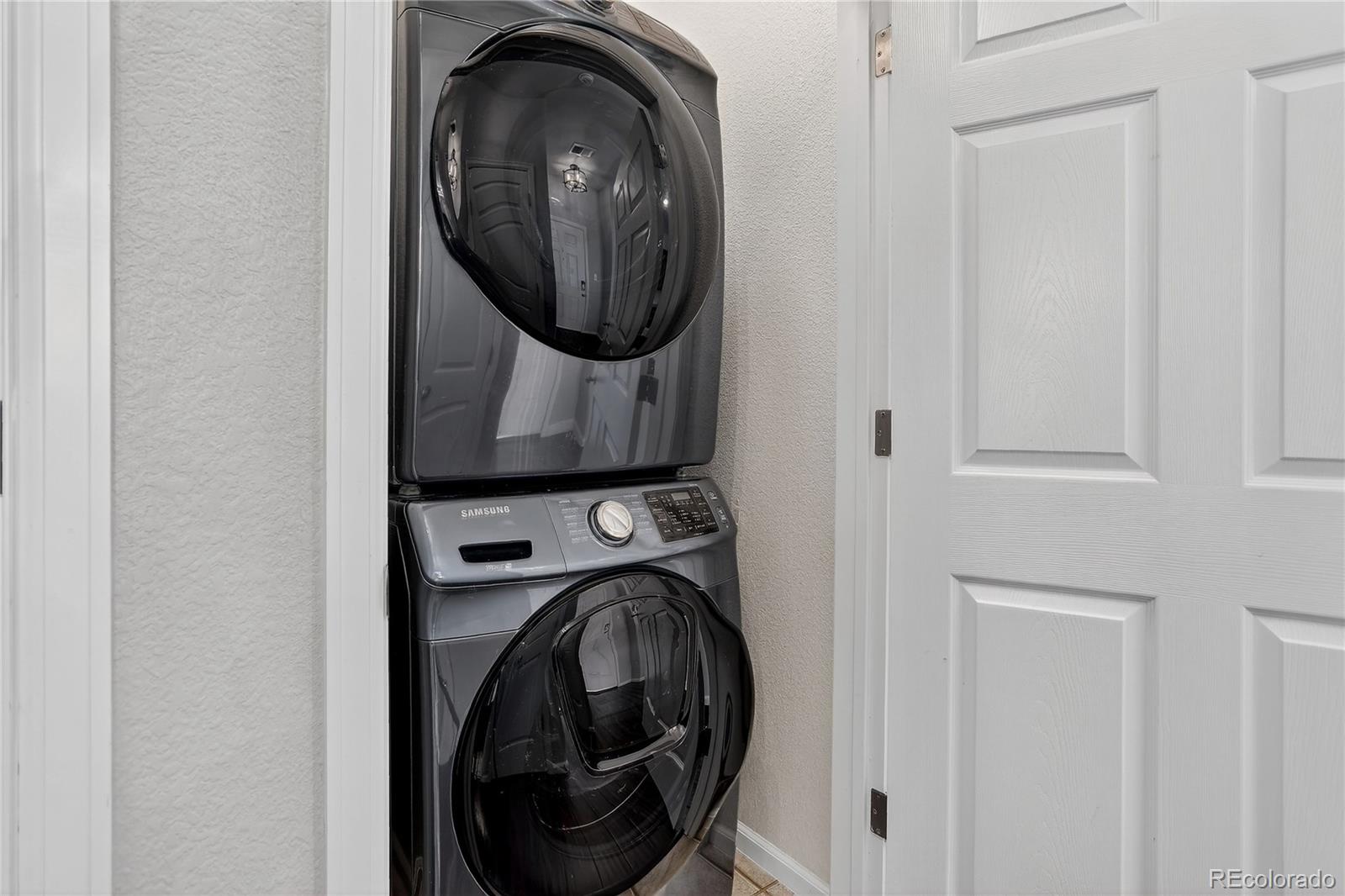 9633 East 5th Avenue, Unit 10208 Denver, CO 80230 - Photo 27 of 47 a utility room with dryer and washer