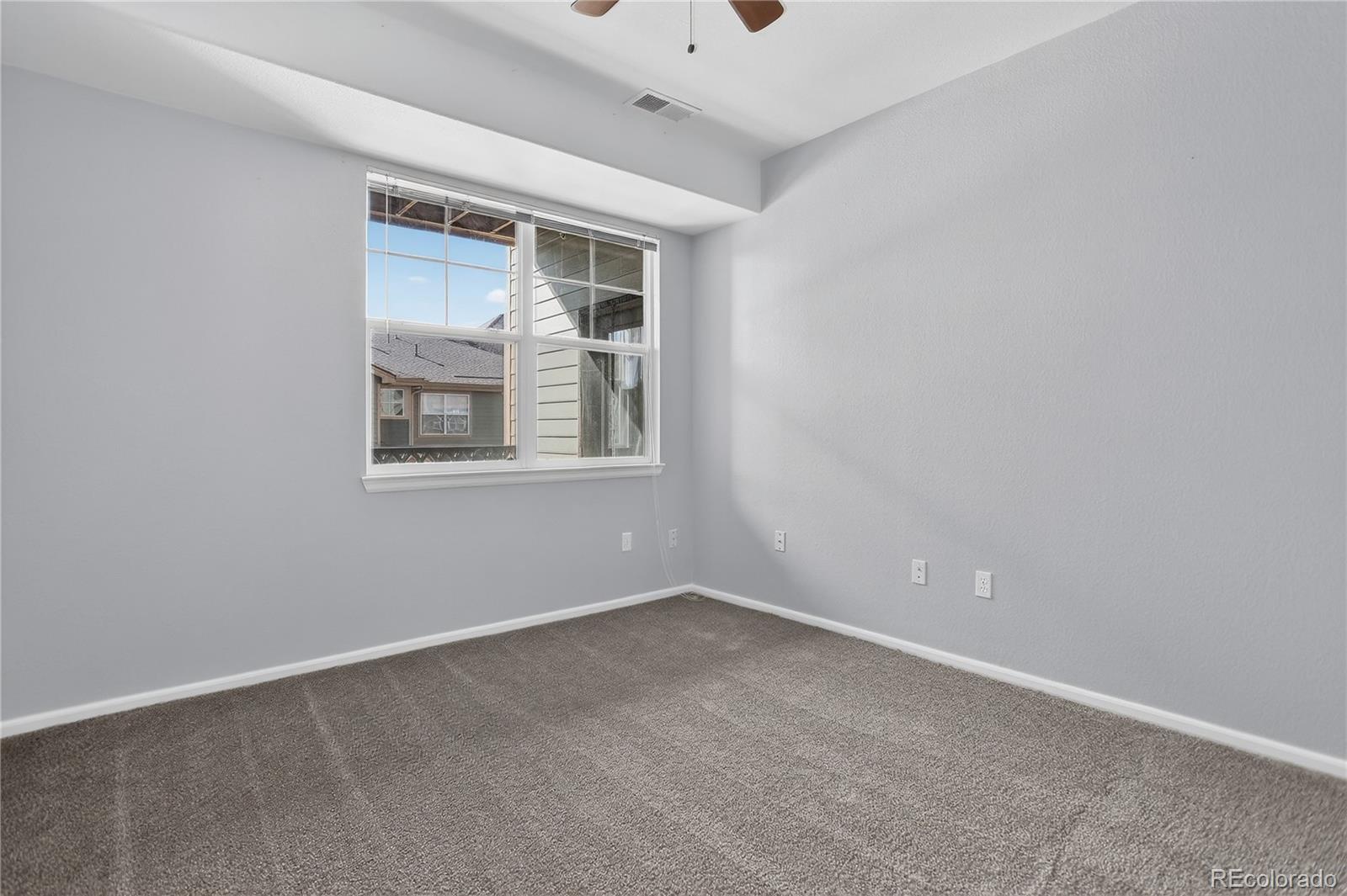 9633 East 5th Avenue, Unit 10208 Denver, CO 80230 - Photo 32 of 47 an empty room with a window