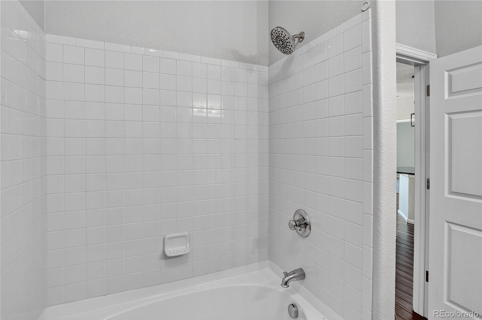 9633 East 5th Avenue, Unit 10208 Denver, CO 80230 - Photo 36 of 47 a bathroom with a bathtub