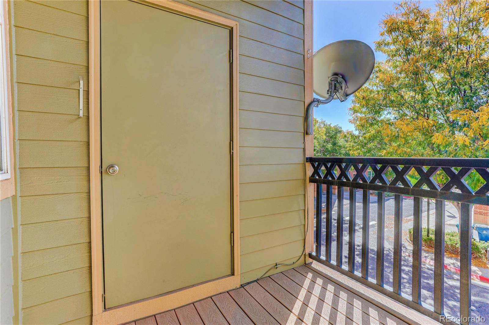 9633 East 5th Avenue, Unit 10208 Denver, CO 80230 - Photo 37 of 47 a view of a balcony with wooden floor