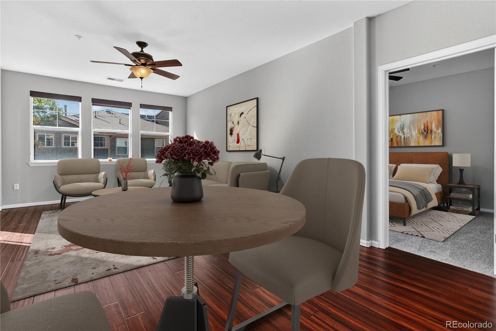 9633 East 5th Avenue, Unit 10208 Denver, CO 80230 - Photo 7 of 47 a view of a dining room with furniture and wooden floor
