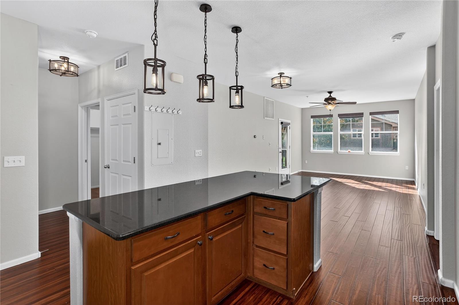 9633 East 5th Avenue, Unit 10208 Denver, CO 80230 - Photo 8 of 47 wooden floor in an empty room with a window