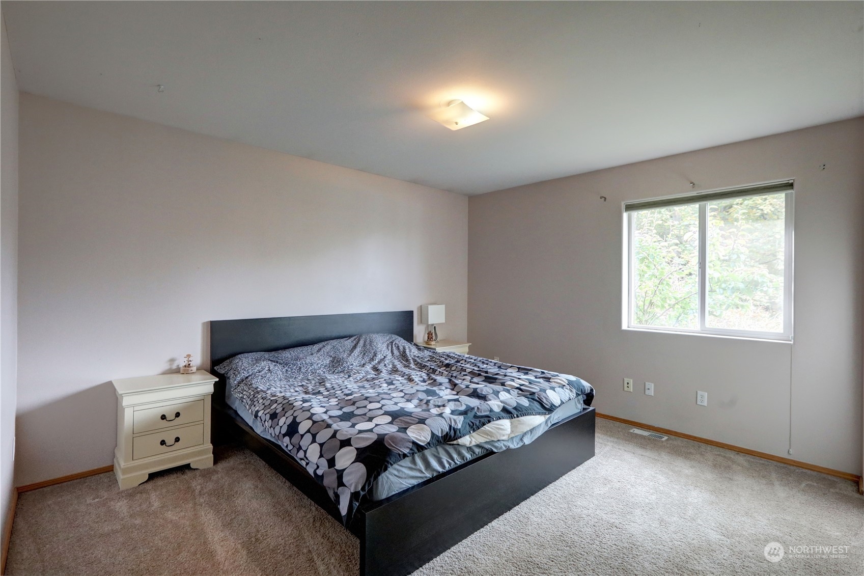 307 Southwest 295th Place Federal Way, WA 98023 - Photo 20 of 25 a bedroom with a bed and a window