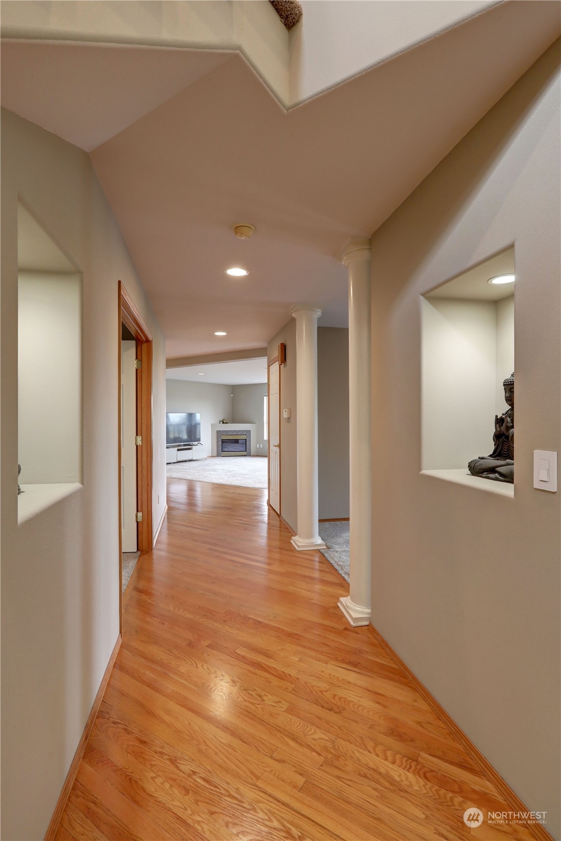 307 Southwest 295th Place Federal Way, WA 98023 - Photo 3 of 25 a view of a hallway with wooden floor and a large window