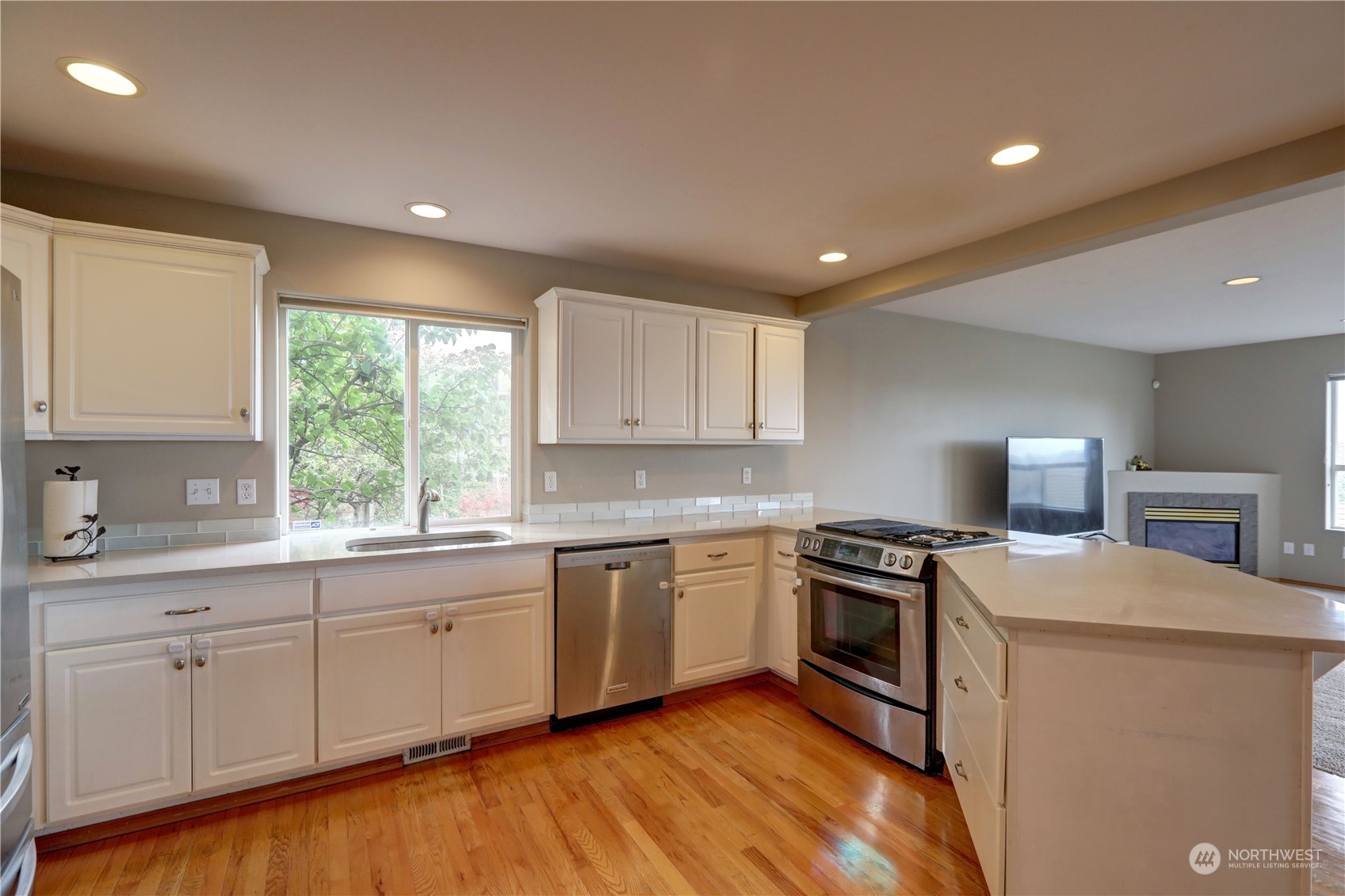 307 Southwest 295th Place Federal Way, WA 98023 - Photo 5 of 25 a kitchen with a sink stove and cabinets