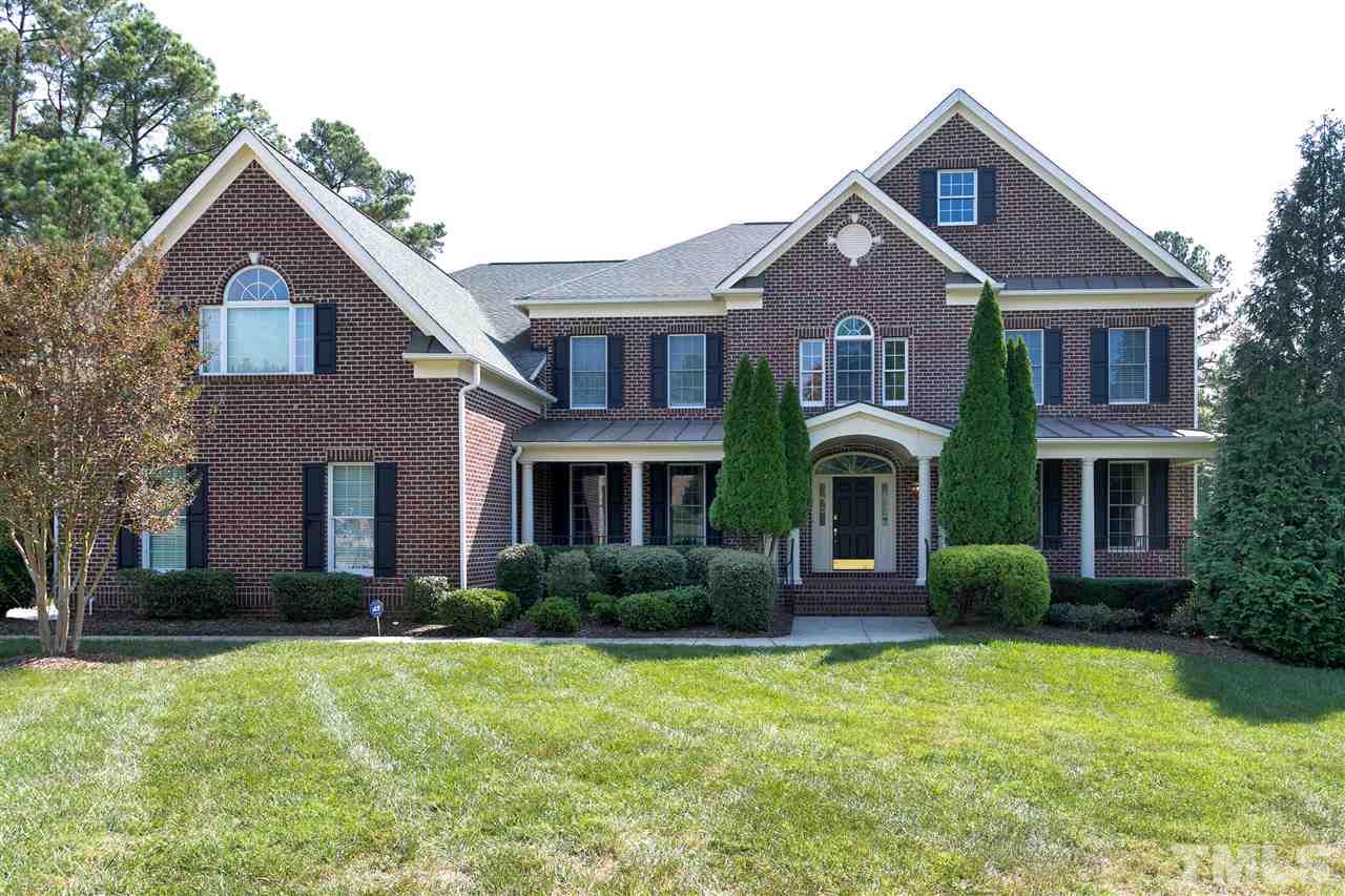9505 Bluemont Court Raleigh, NC 27617 - Photo 1 of 25 a front view of a house with garden