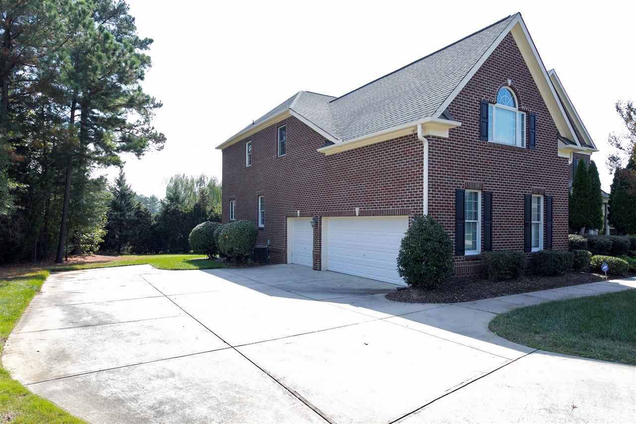 9505 Bluemont Court Raleigh, NC 27617 - Photo 2 of 25 a house view with a outdoor space