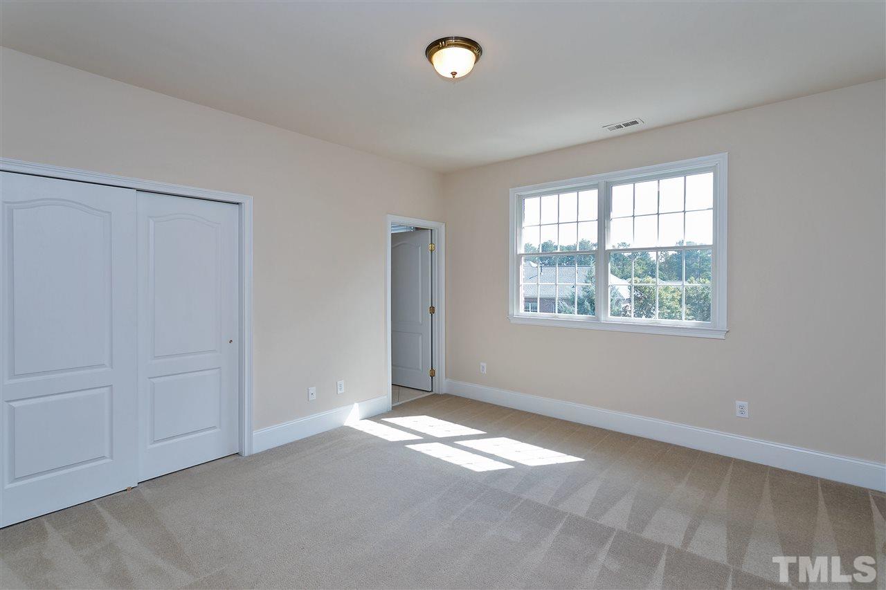 9505 Bluemont Court Raleigh, NC 27617 - Photo 16 of 25 an empty room with a window