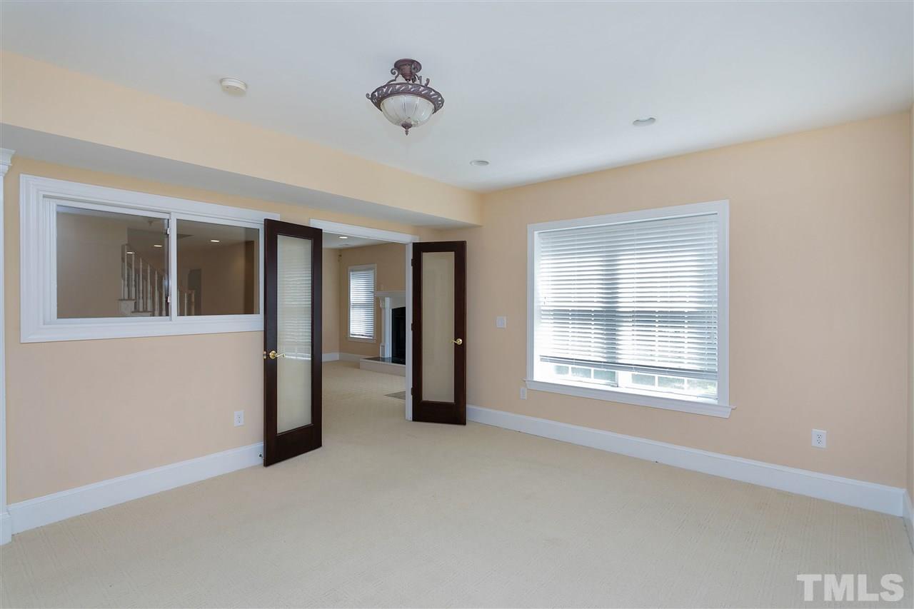 9505 Bluemont Court Raleigh, NC 27617 - Photo 23 of 25 a view of an empty room with a window