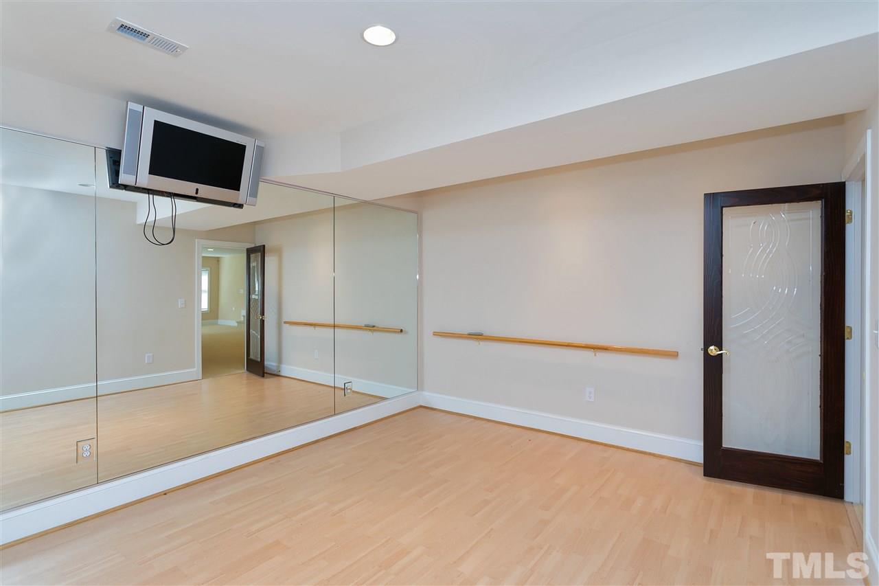 9505 Bluemont Court Raleigh, NC 27617 - Photo 24 of 25 a view of a livingroom with a flat screen tv