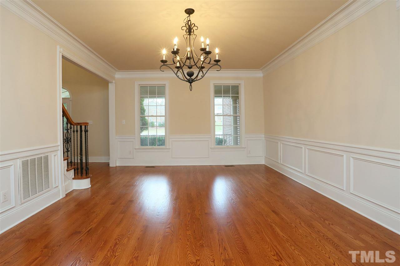 9505 Bluemont Court Raleigh, NC 27617 - Photo 10 of 25 a view of livingroom with window and wooden floor