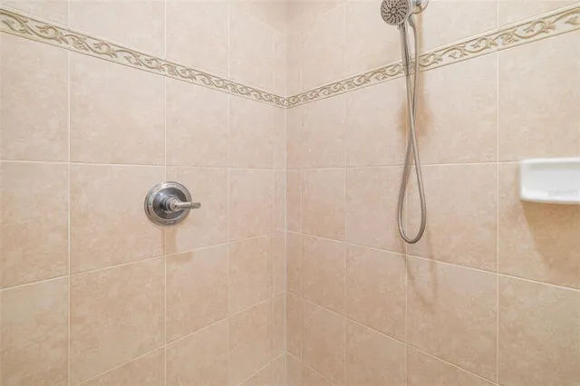 a view of a hallway with wooden shelves