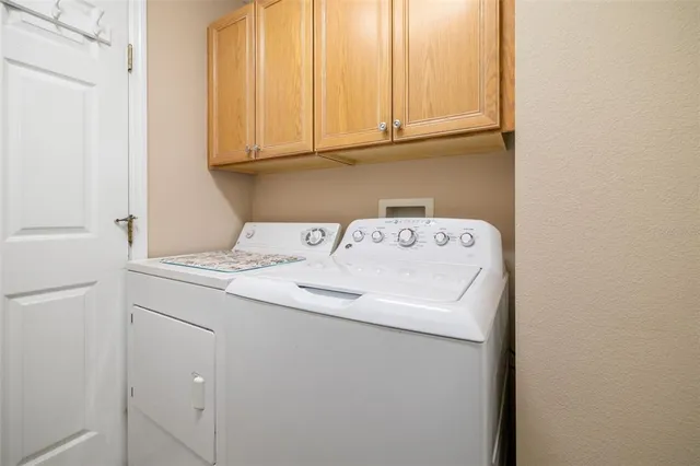 a wooden bench sitting in front of a building