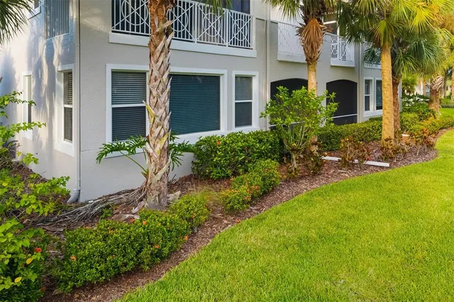 an aerial view of a house with a garden and yard