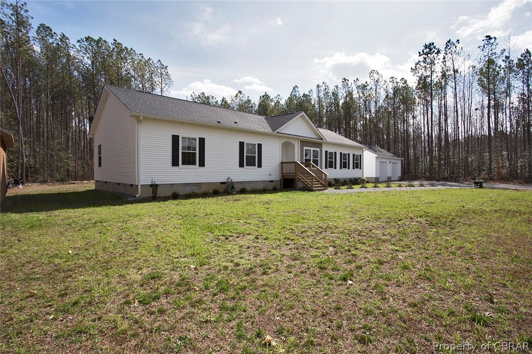 1496 Elsom Mascot Road Mattaponi, VA 23110 - Photo 30 of 33 a house with garden in front of it