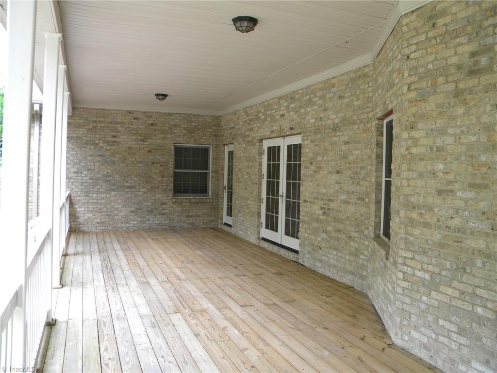 9137 County Line Road Kernersville, NC 27284 - Photo 3 of 28 Main level back covered porch area. Great for entertaining, watching TV, or just relaxing as you listen to the birds chirp.