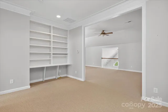 a view of an empty room with a closet
