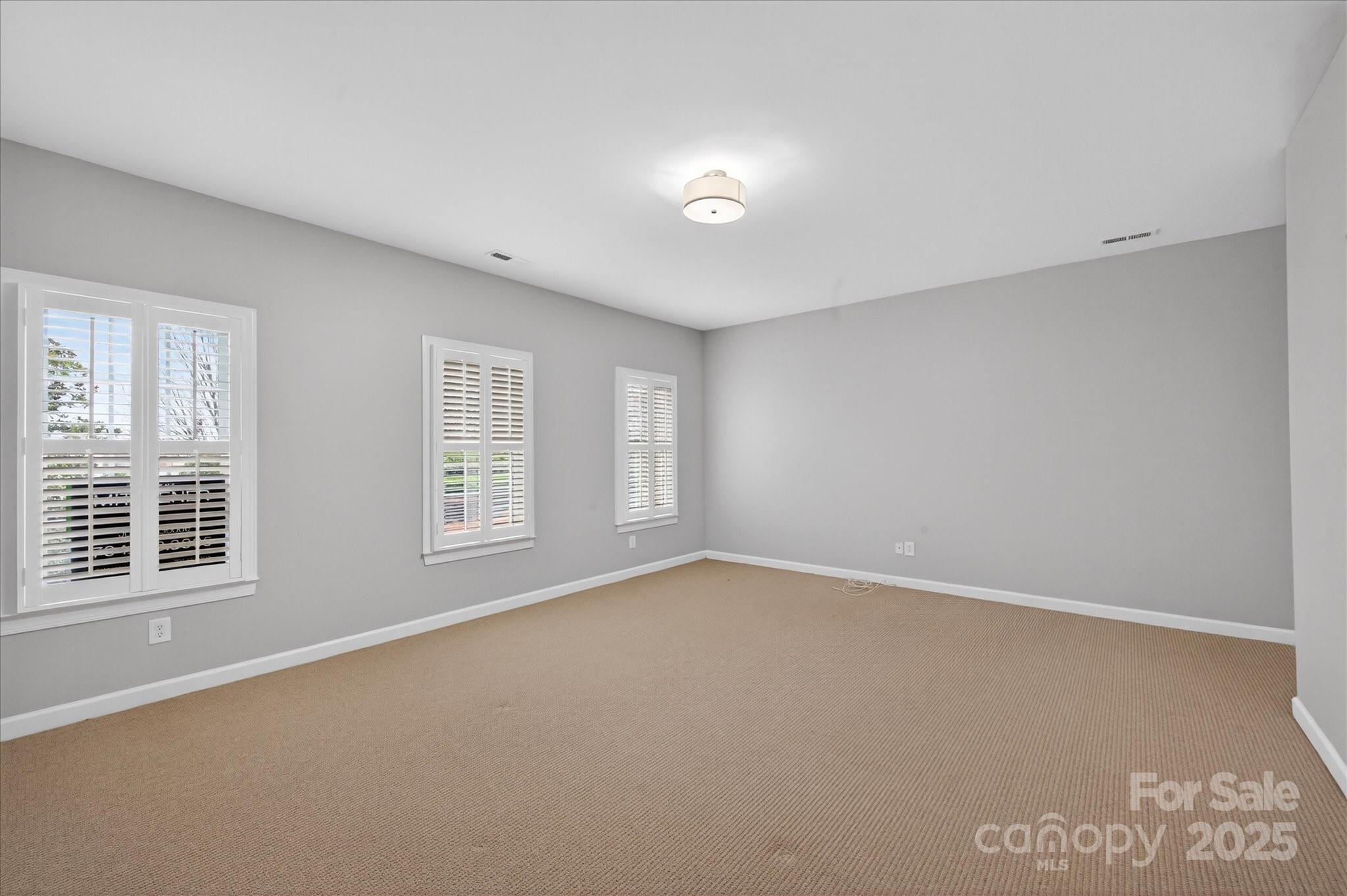 11756 Easthampton Circle Charlotte, NC 28277 - Photo 23 of 35 an empty room with windows