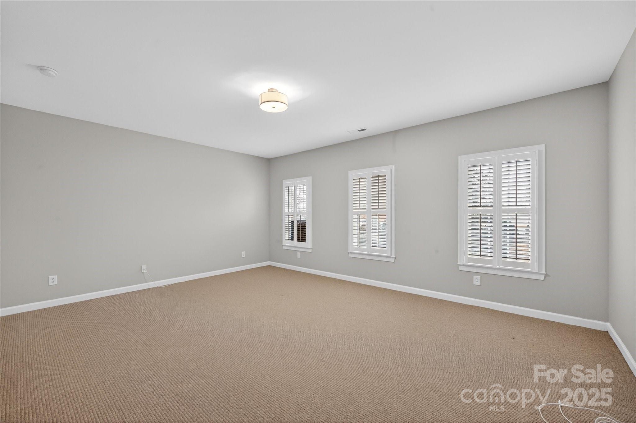 11756 Easthampton Circle Charlotte, NC 28277 - Photo 24 of 35 an empty room with windows