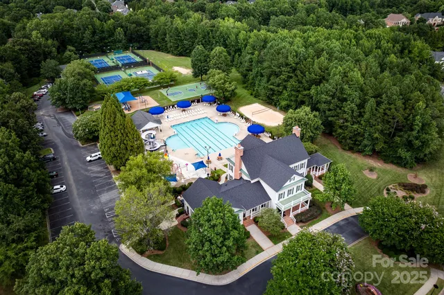 an aerial view of a house with an outdoor space