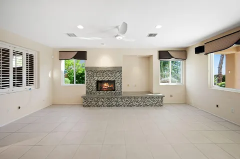a view of a kitchen with a sink refrigerator and wooden floor