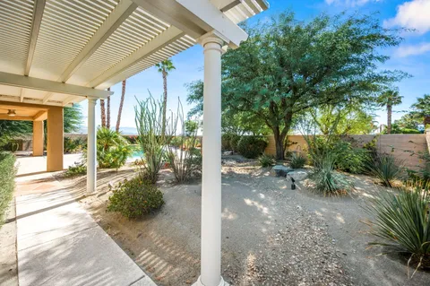 a view of swimming pool with outdoor space and seating area