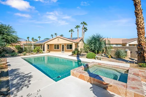 a aerial view of a house with a yard