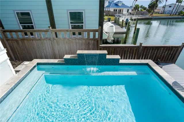 a view of a wooden deck and a lake view