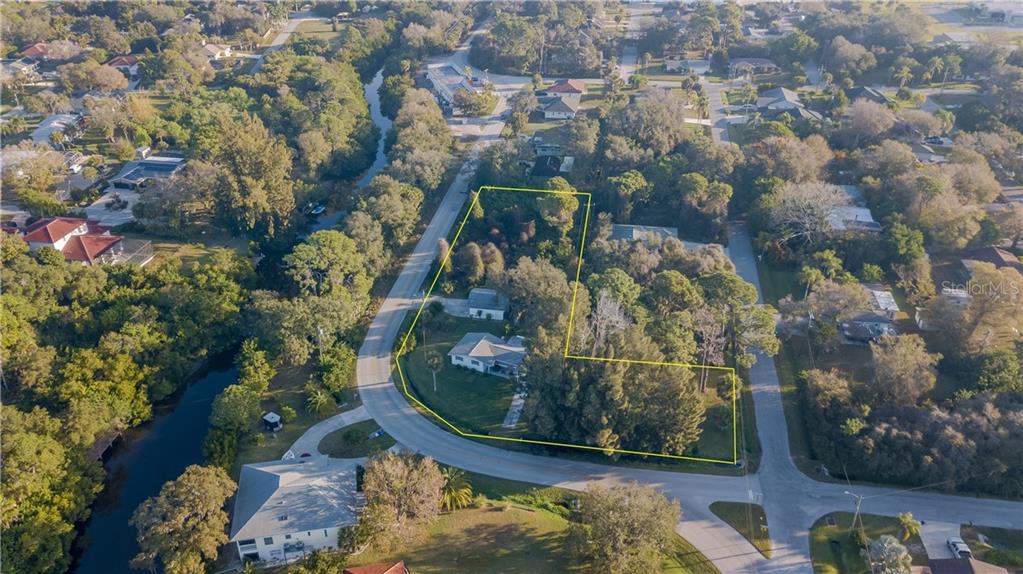 391 Alligator Drive Venice, FL 34293 - Photo 1 of 1 an aerial view of a house with a yard