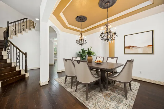 a bathroom with a tub a sink a mirror and a shower