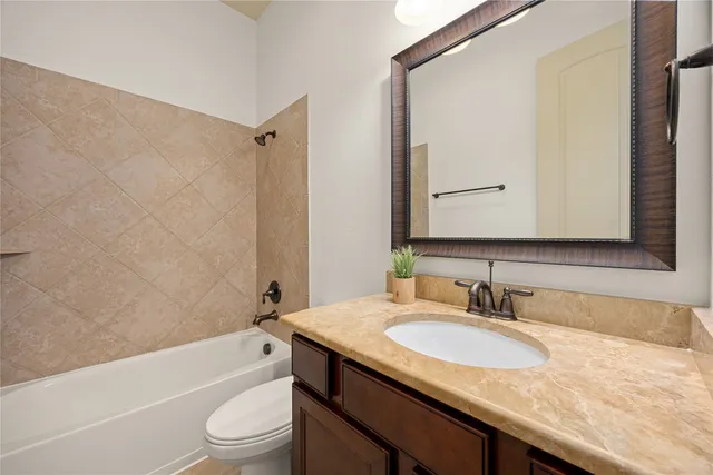 a living room with furniture a rug and a window