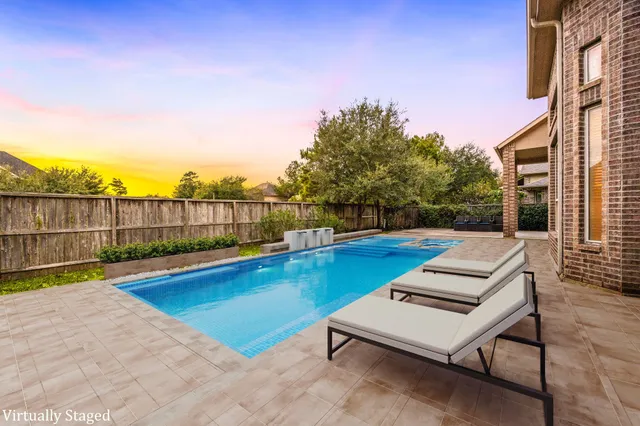 a picture of a bench in front of building