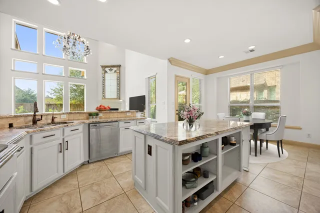 a view of a dining room with furniture and window