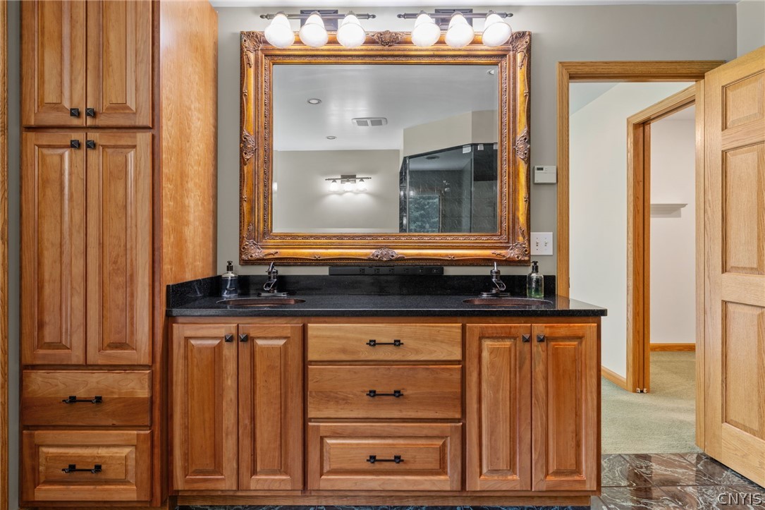 1103 Rail Fence Road Camillus, NY 13031 - Photo 35 of 50 Beautiful wood vanity! Solid doors throughout the house, custom!