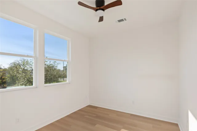 a bathroom with a toilet and a bathtub