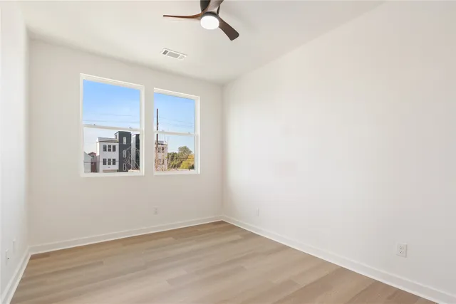 a view of a hallway with white walls