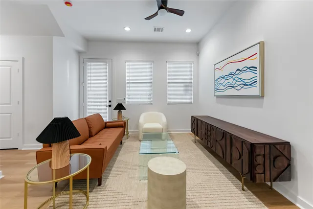 a living room with furniture and a window