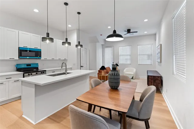 a dining room with furniture and a window