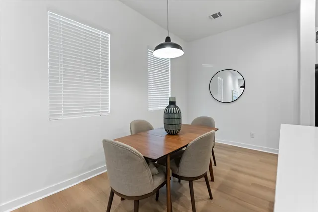 a view of a kitchen with a sink and a window