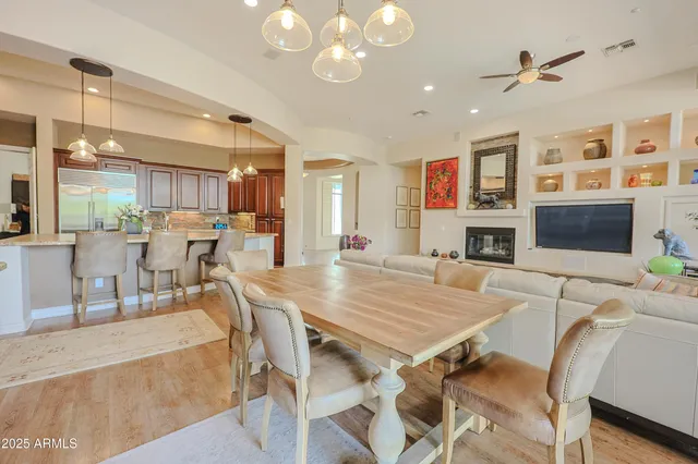 a large kitchen with stainless steel appliances kitchen island granite countertop a refrigerator