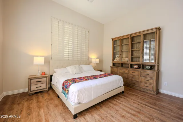 a bathroom with a sink toilet vanity and shower