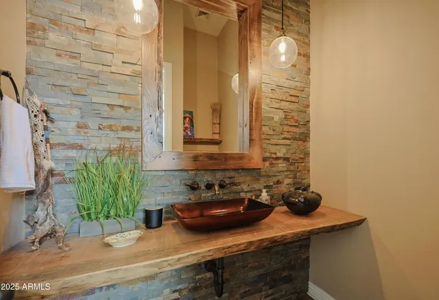 a spacious bedroom with a bed a couch and a window