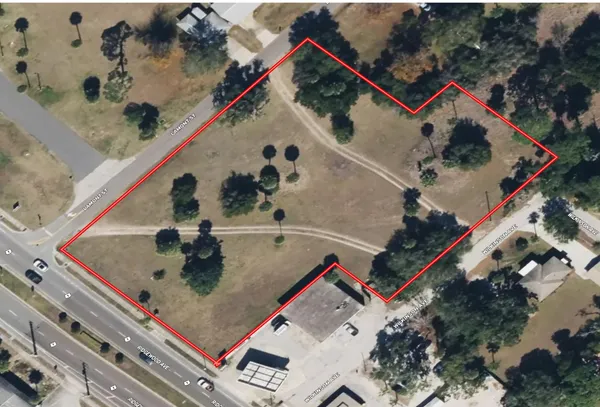 an aerial view of a house with a swimming pool