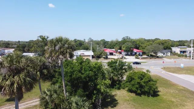 a terrace with outdoor seating and trees