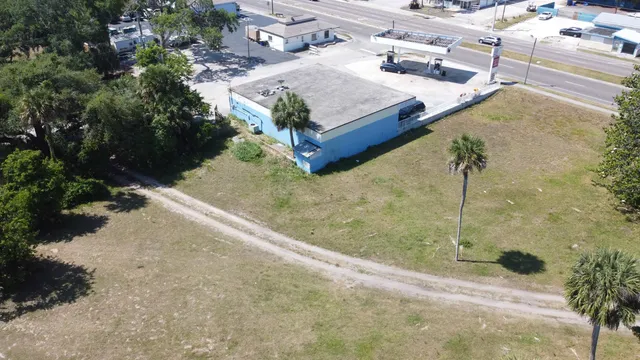 a view of a swimming pool with a yard