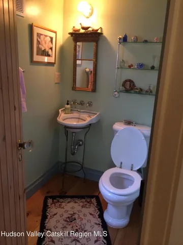 a bathroom with a toilet and a sink