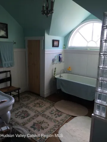a bathroom with a sink a toilet and bathtub