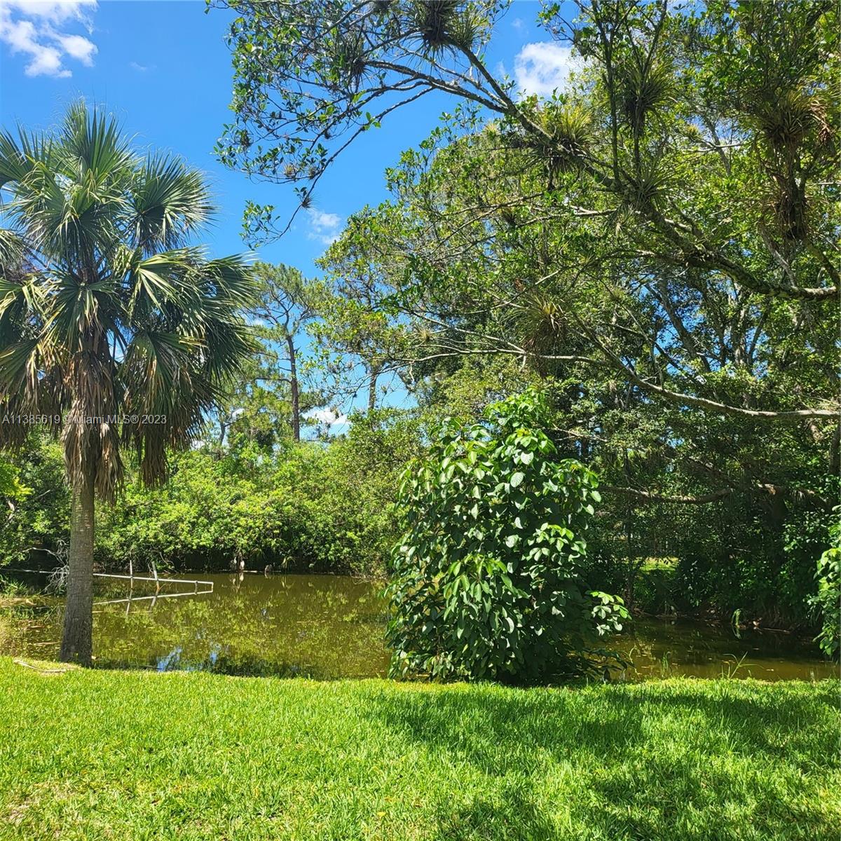 915 B Road Loxahatchee, FL 33470 - Photo 4 of 42 a view of lake background with house