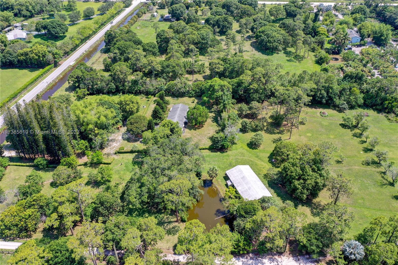 915 B Road Loxahatchee, FL 33470 - Photo 41 of 42 an aerial view of a house with a yard and outdoor seating